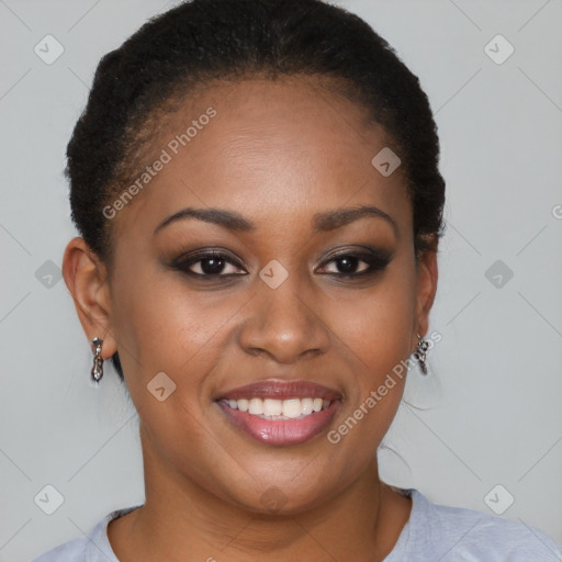 Joyful black young-adult female with short  brown hair and brown eyes