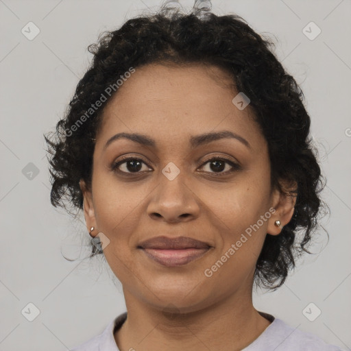 Joyful black adult female with short  brown hair and brown eyes