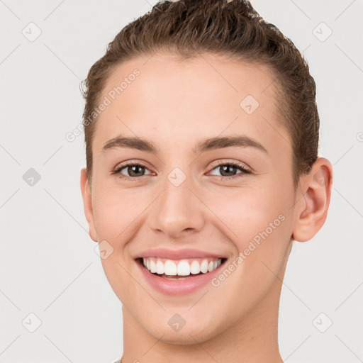 Joyful white young-adult female with short  brown hair and brown eyes