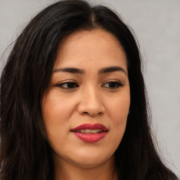 Joyful asian young-adult female with long  brown hair and brown eyes