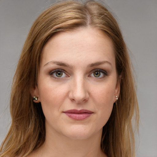 Joyful white young-adult female with long  brown hair and grey eyes