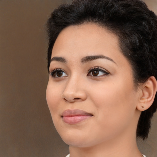 Joyful white young-adult female with medium  black hair and brown eyes