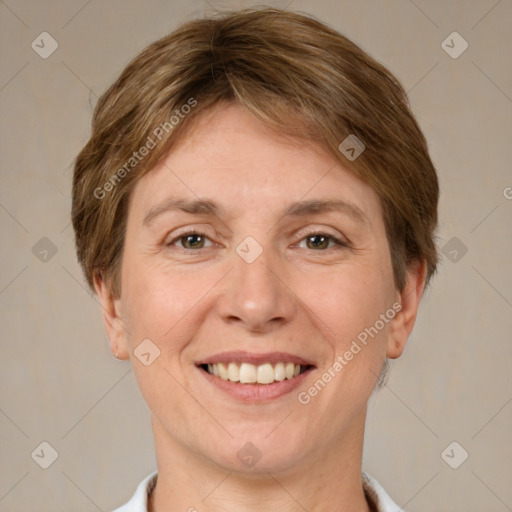 Joyful white adult female with short  brown hair and brown eyes