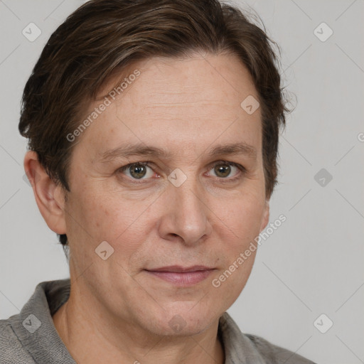 Joyful white adult female with short  brown hair and grey eyes