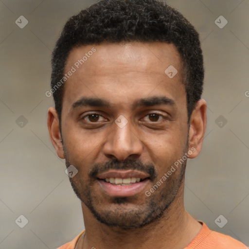 Joyful black young-adult male with short  black hair and brown eyes