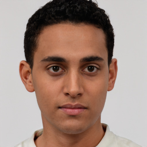 Neutral latino young-adult male with short  brown hair and brown eyes
