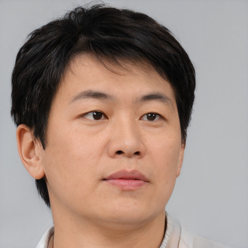Neutral asian young-adult male with short  brown hair and brown eyes