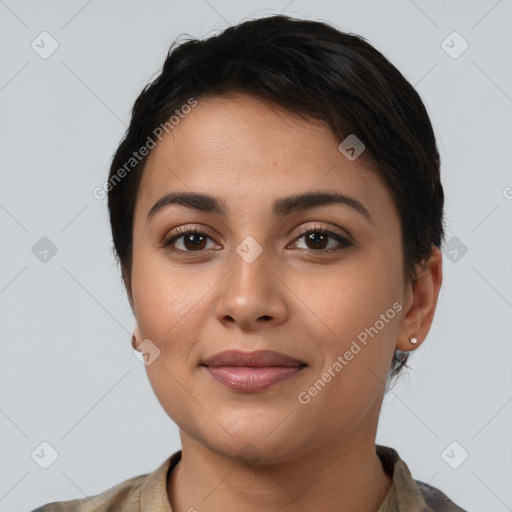 Joyful latino young-adult female with short  brown hair and brown eyes