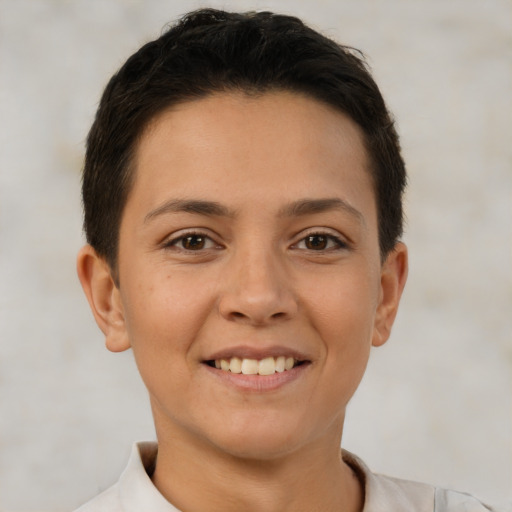 Joyful white young-adult female with short  brown hair and brown eyes