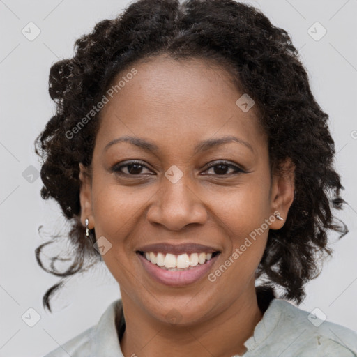 Joyful black young-adult female with medium  brown hair and brown eyes