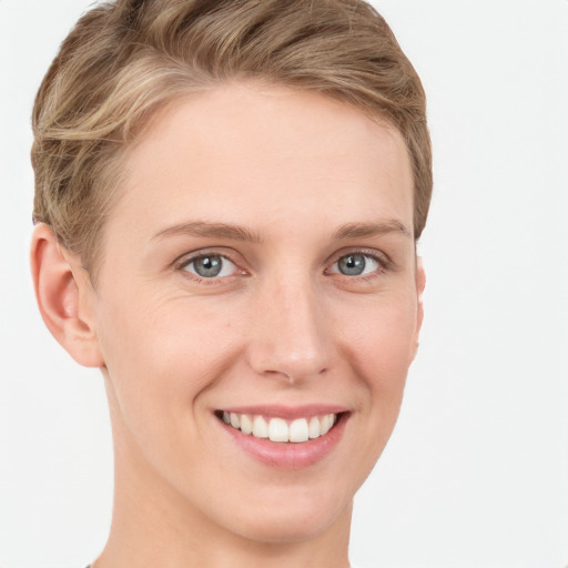 Joyful white young-adult female with short  brown hair and grey eyes