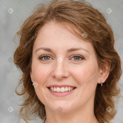 Joyful white young-adult female with medium  brown hair and blue eyes