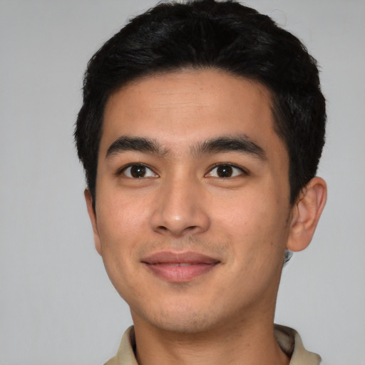 Joyful asian young-adult male with short  black hair and brown eyes