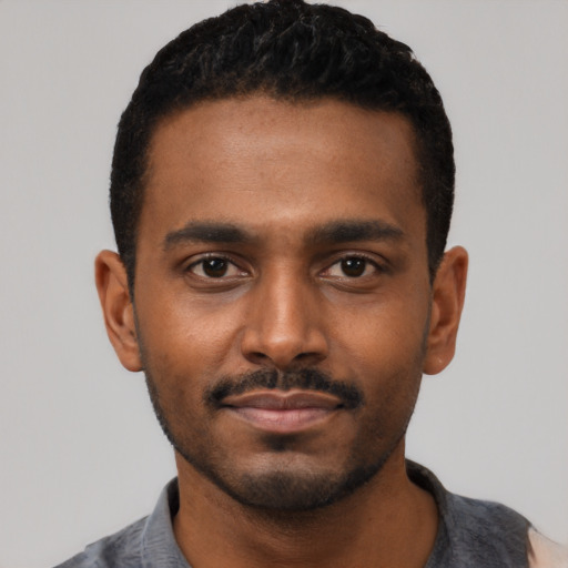 Neutral black young-adult male with short  black hair and brown eyes