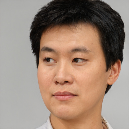 Neutral asian young-adult male with short  brown hair and brown eyes