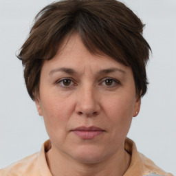 Joyful white adult female with short  brown hair and brown eyes