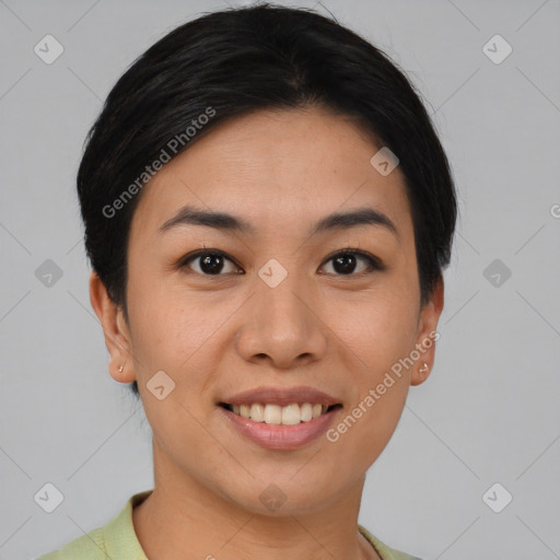 Joyful asian young-adult female with short  black hair and brown eyes