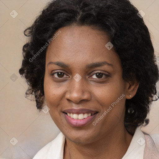 Joyful black adult female with long  brown hair and brown eyes