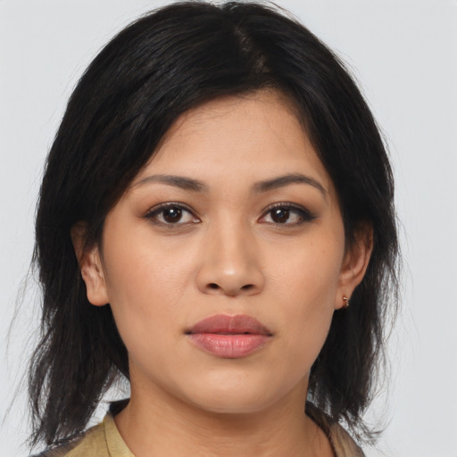 Joyful asian young-adult female with medium  brown hair and brown eyes