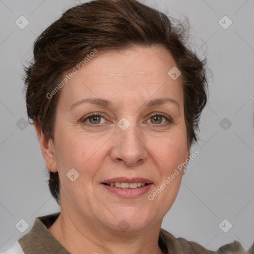 Joyful white adult female with short  brown hair and grey eyes