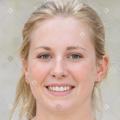 Joyful white young-adult female with medium  brown hair and blue eyes