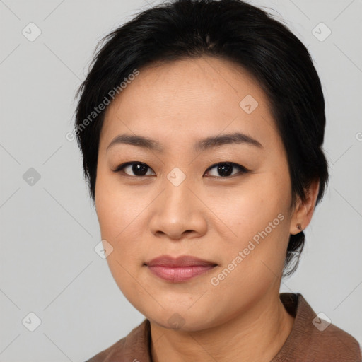 Joyful asian young-adult female with medium  black hair and brown eyes