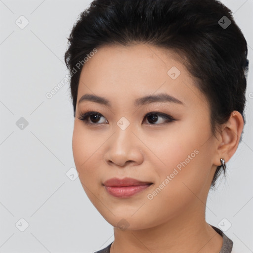 Joyful asian young-adult female with medium  black hair and brown eyes