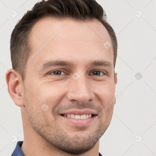 Joyful white young-adult male with short  brown hair and grey eyes