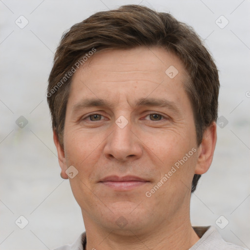 Joyful white adult male with short  brown hair and grey eyes