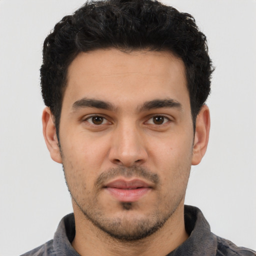 Neutral white young-adult male with short  black hair and brown eyes