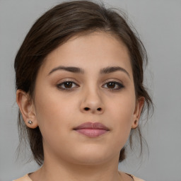 Neutral white young-adult female with medium  brown hair and brown eyes