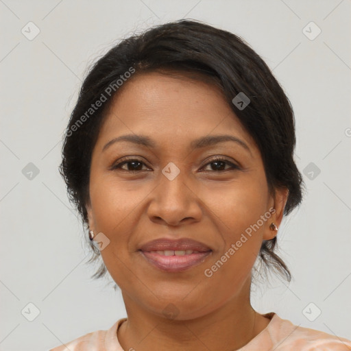 Joyful latino adult female with medium  brown hair and brown eyes