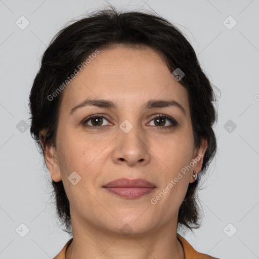 Joyful white adult female with medium  brown hair and brown eyes