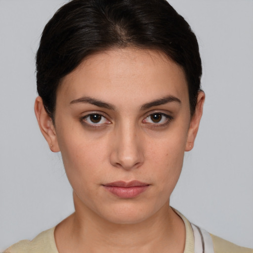 Neutral white young-adult female with short  brown hair and brown eyes