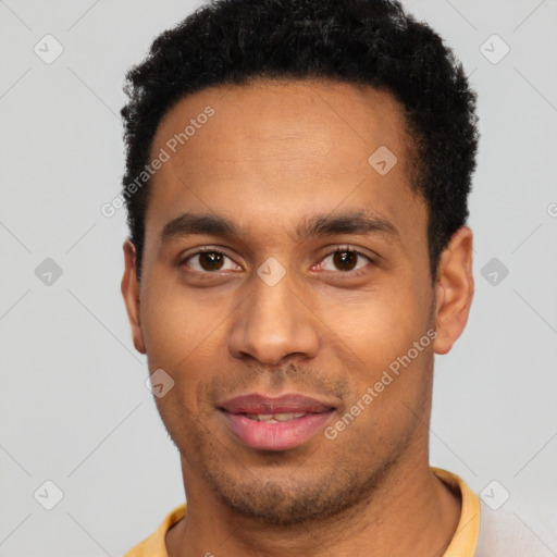 Joyful latino young-adult male with short  black hair and brown eyes