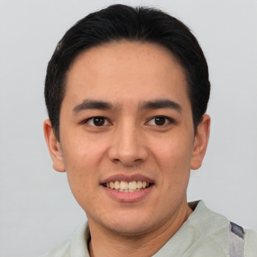 Joyful asian young-adult male with short  brown hair and brown eyes