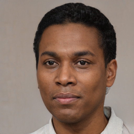 Neutral black young-adult male with short  black hair and brown eyes