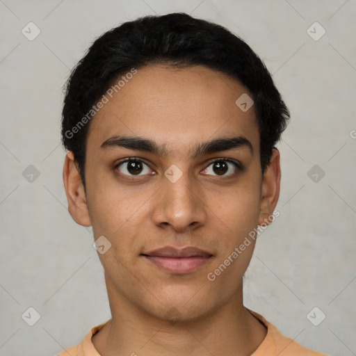 Joyful latino young-adult male with short  black hair and brown eyes