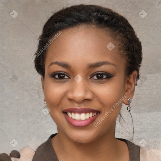 Joyful black young-adult female with long  black hair and brown eyes