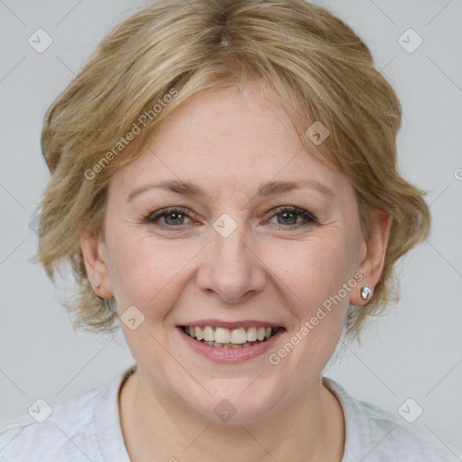 Joyful white adult female with medium  brown hair and blue eyes