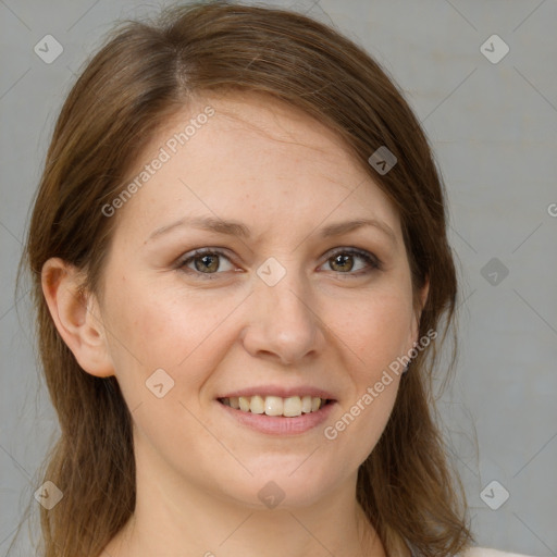 Joyful white adult female with medium  brown hair and brown eyes