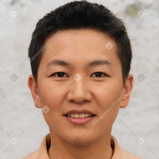 Joyful asian young-adult male with short  brown hair and brown eyes