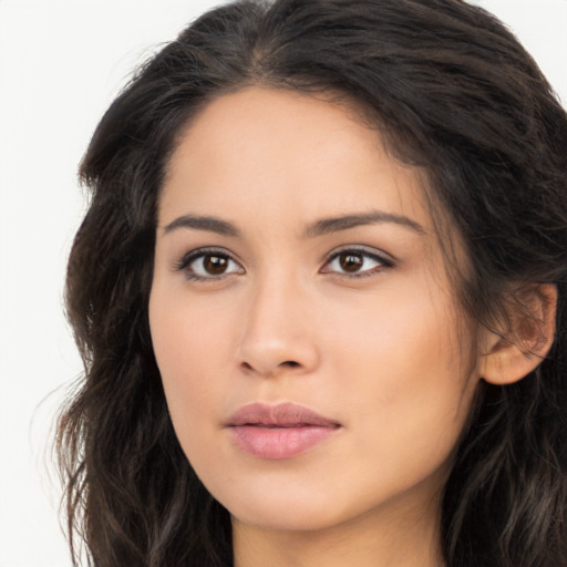 Joyful asian young-adult female with long  brown hair and brown eyes