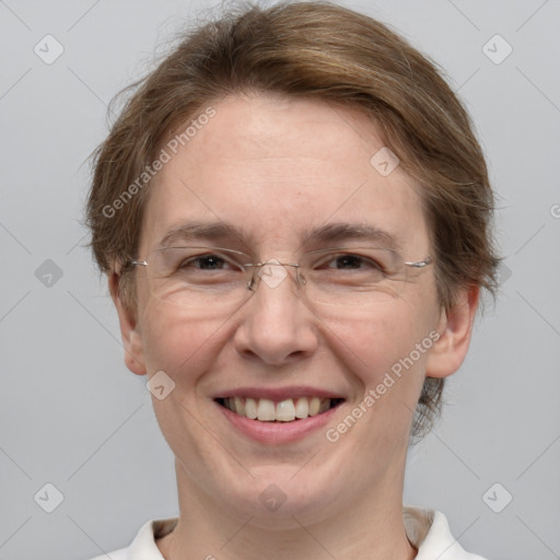 Joyful white adult female with medium  brown hair and grey eyes