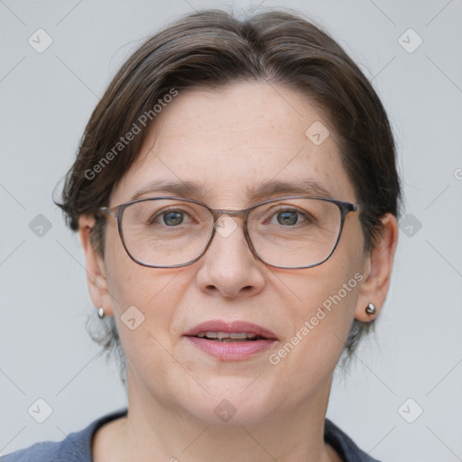 Joyful white adult female with medium  brown hair and grey eyes