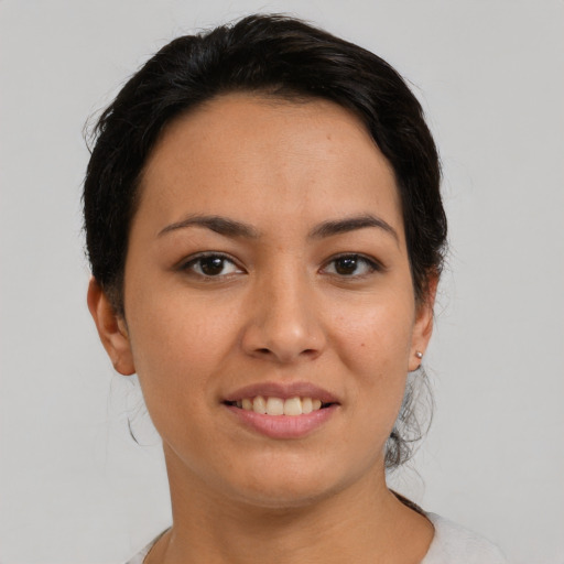 Joyful asian young-adult female with short  black hair and brown eyes