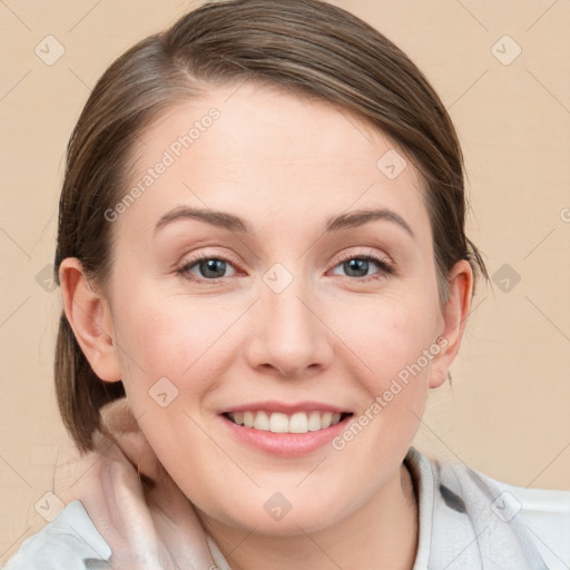 Joyful white young-adult female with medium  brown hair and blue eyes