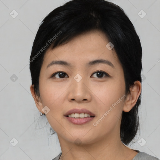 Joyful asian young-adult female with short  black hair and brown eyes