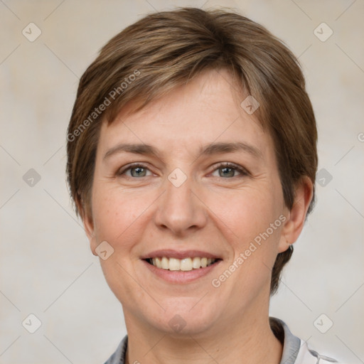 Joyful white adult female with short  brown hair and grey eyes