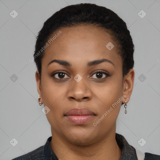 Joyful black young-adult female with short  black hair and brown eyes